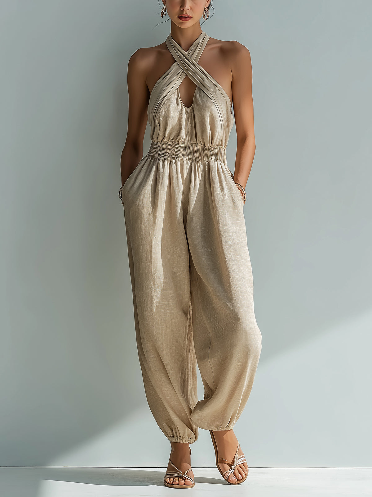 ElevenOra Chic Elegant Beige Linen Cross Halter-Neck Sleeveless Cutout Detail Elastic-Waist Loose-Fit Cuffed Jumpsuit