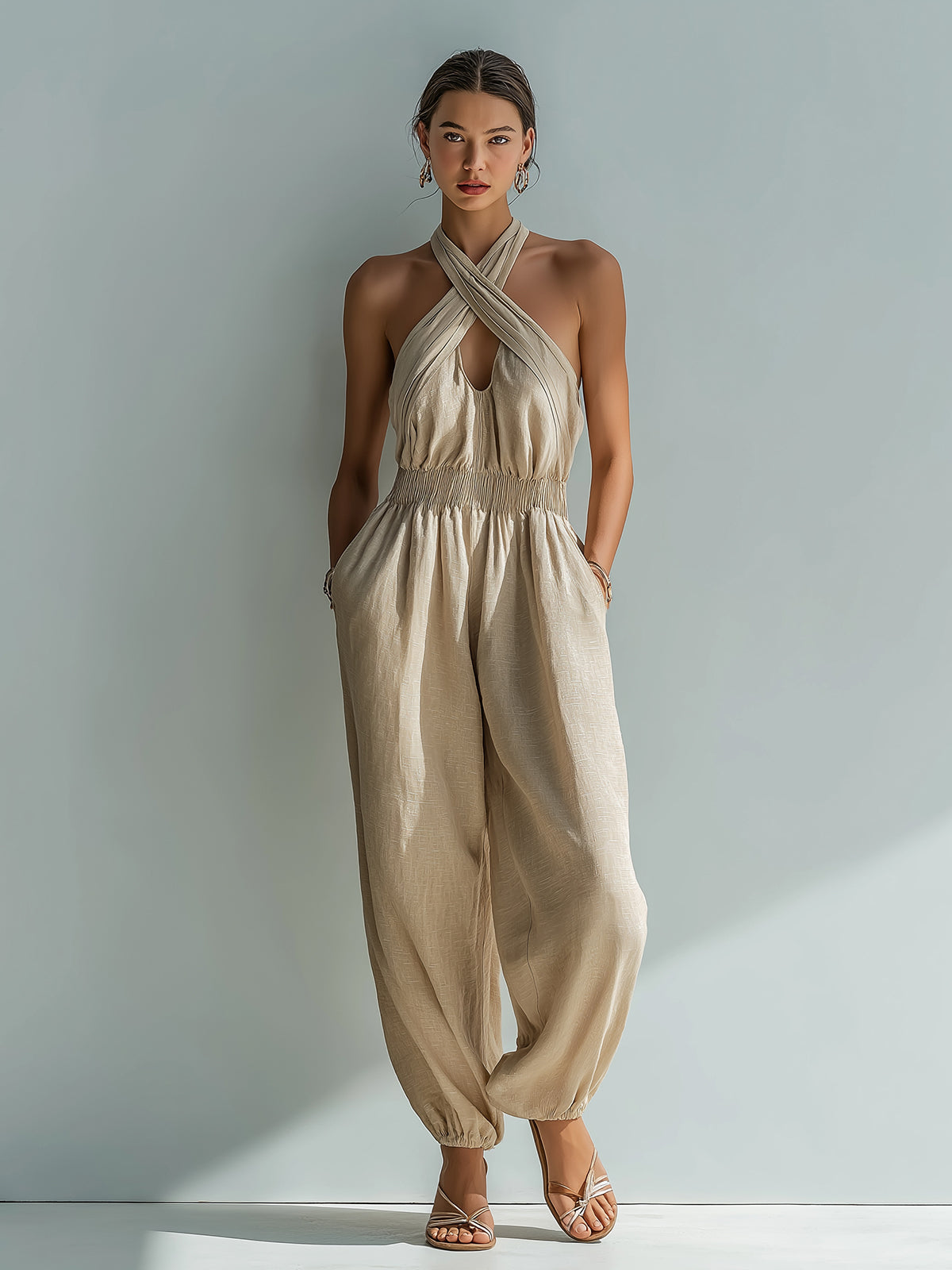 ElevenOra Chic Elegant Beige Linen Cross Halter-Neck Sleeveless Cutout Detail Elastic-Waist Loose-Fit Cuffed Jumpsuit